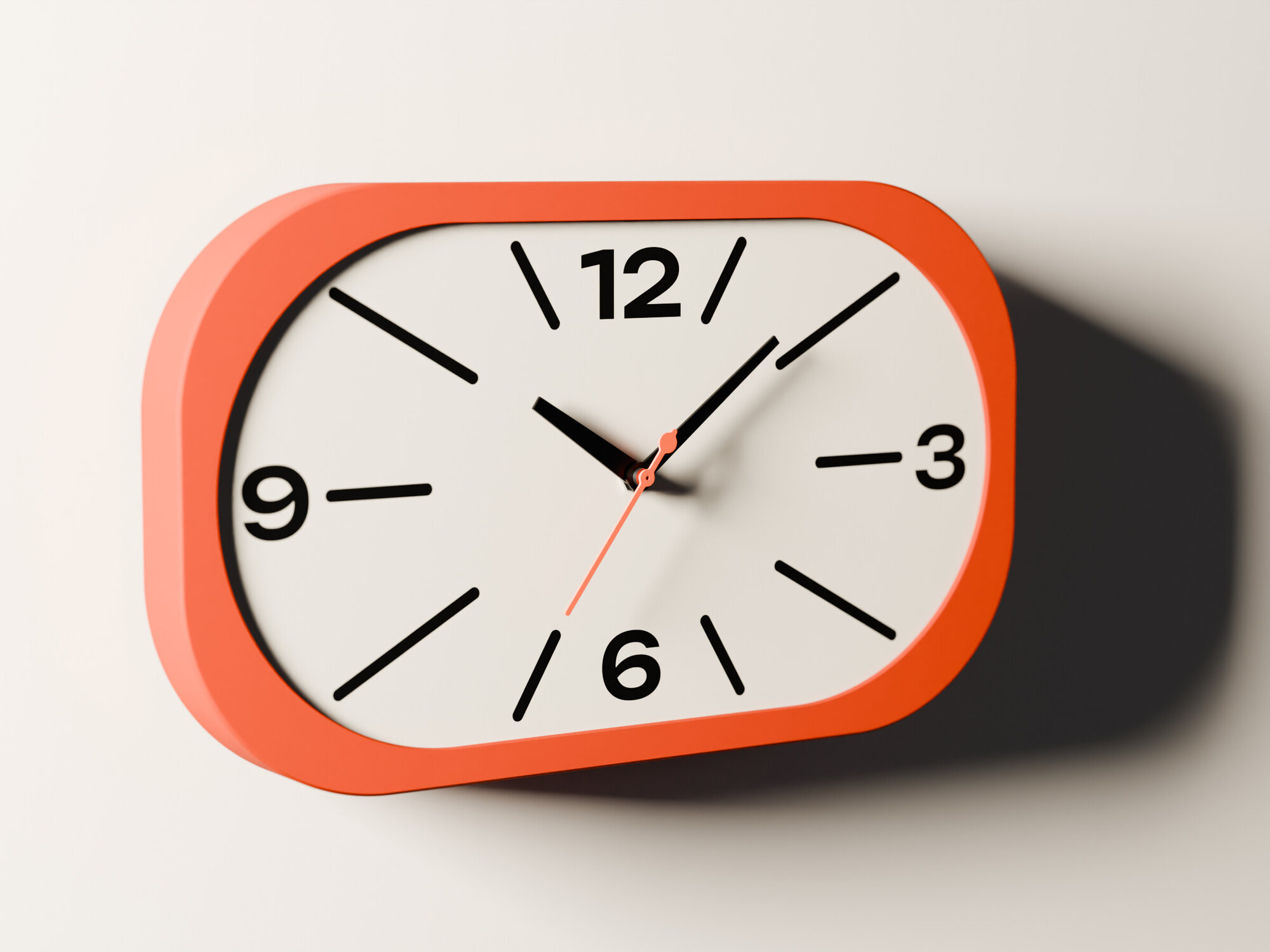 The Stadium clock on a pale wall from the left, its shadow falling to the right.